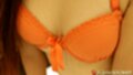 In orange bra